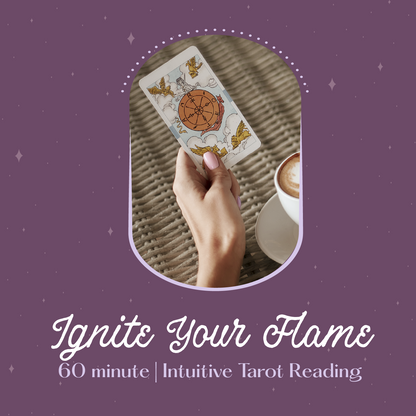 Hand holding a tarot card with a cup of coffee on a purple background, featuring text 'Ignite Your Flame'.